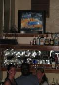 Celebrating U of K win at Tipsy Tuna Acroos street and Sidewalk from Sunsets Belize in Placencia Village